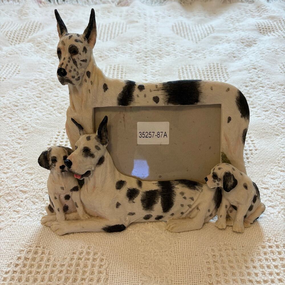 Ceramic picture frame featuring a Harlequin Great Dane family
